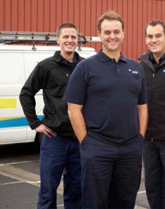 three of our Kendall plumbers standing ready by their truck